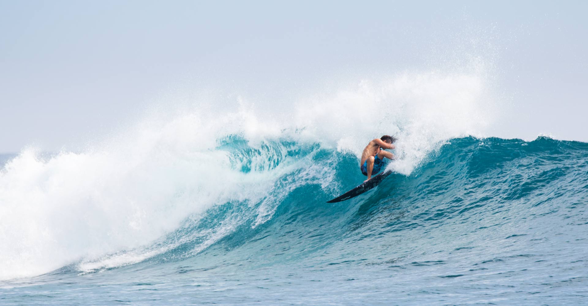 Jackson Coffey Surfing in front of Niyama Surf Resort