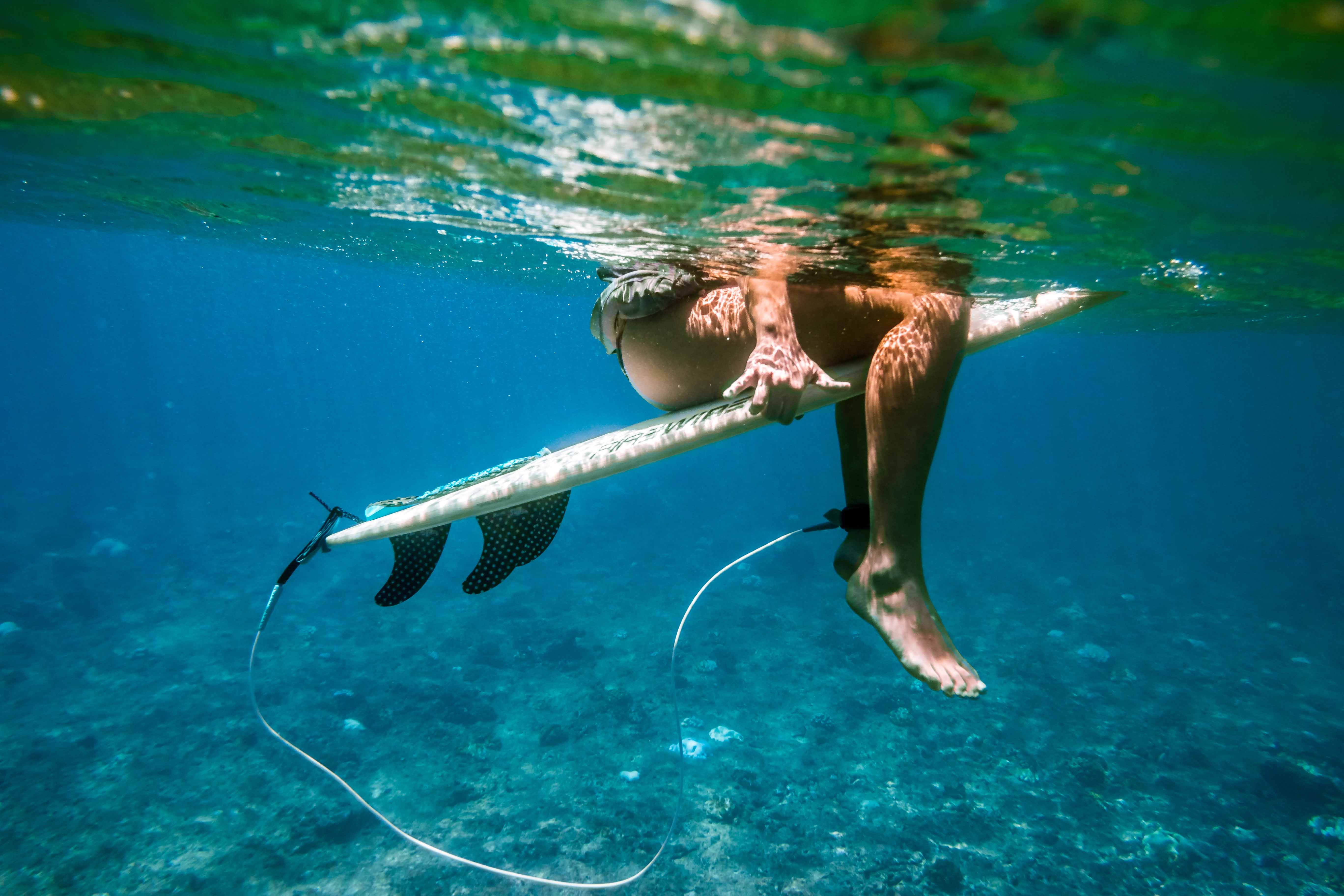 surfing cristal clear waters of the maldives